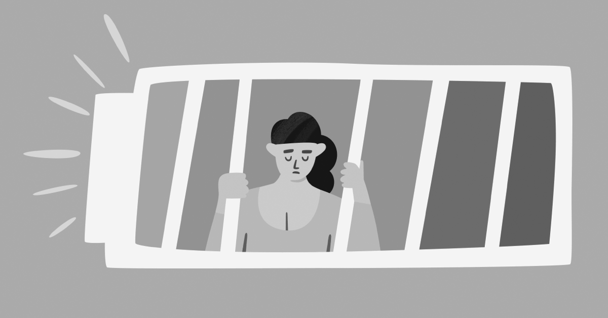 A woman inside a low battery is hanging to its low energy bars.